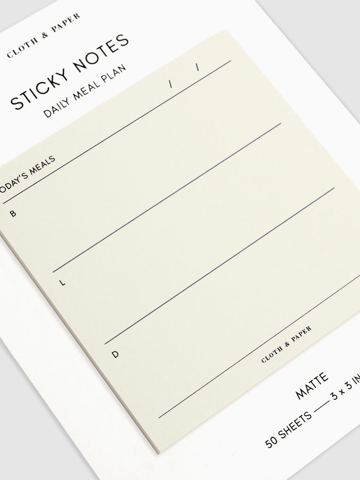 Close-up of a Daily Meal Plan Sticky Notes on their backing, against a neutral background.