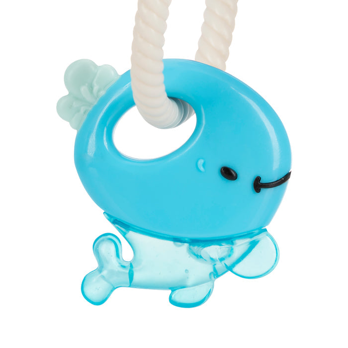 The IcyBite Sea Teether Keys feature a blue whale-shaped teether with a smiling face and fin details on a white textured ring, filled with cooling purICE gel to soothe babies’ sore gums.