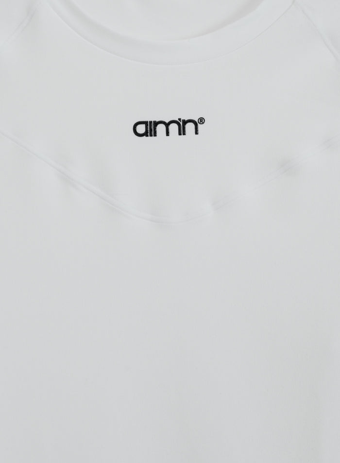 White Soft Basic Short Sleeve top with a black aim'n logo on the chest and a round neckline.