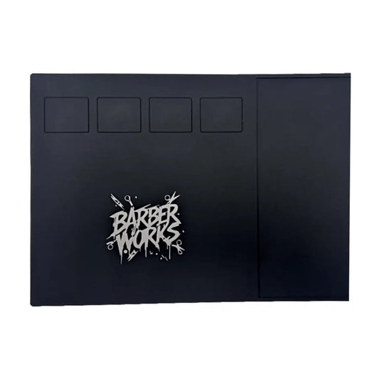 A black rectangular product, likely a case or cover, featuring a stylized silver 'BARBER WORKS' logo on the lower left and four recessed square panels near the top, shown against a plain white background.