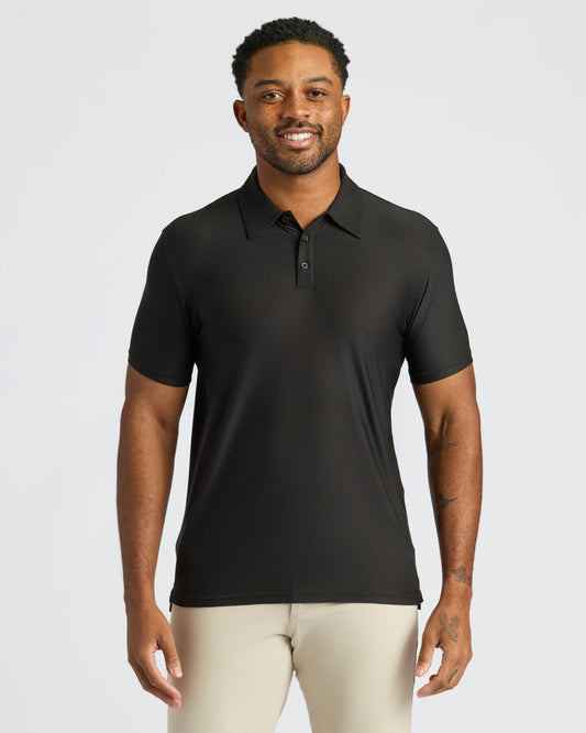 Black Active Polo 2.0 worn by smiling man, showcasing classic fit.