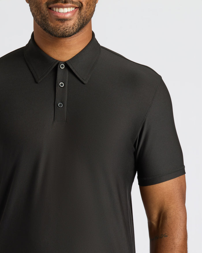 Man wearing Black Active Polo 2.0, showcasing its classic, fitted design.