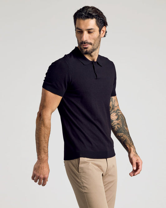 Black Short Sleeve Sweater Polo on tattooed man, relaxed pose.