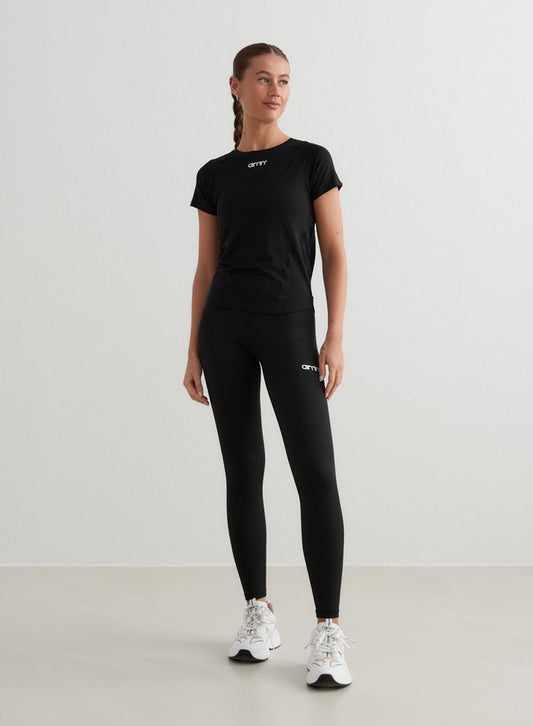 Black Soft Basic Short Sleeve tee with a second skin feel, styled with aim'n leggings and sneakers.