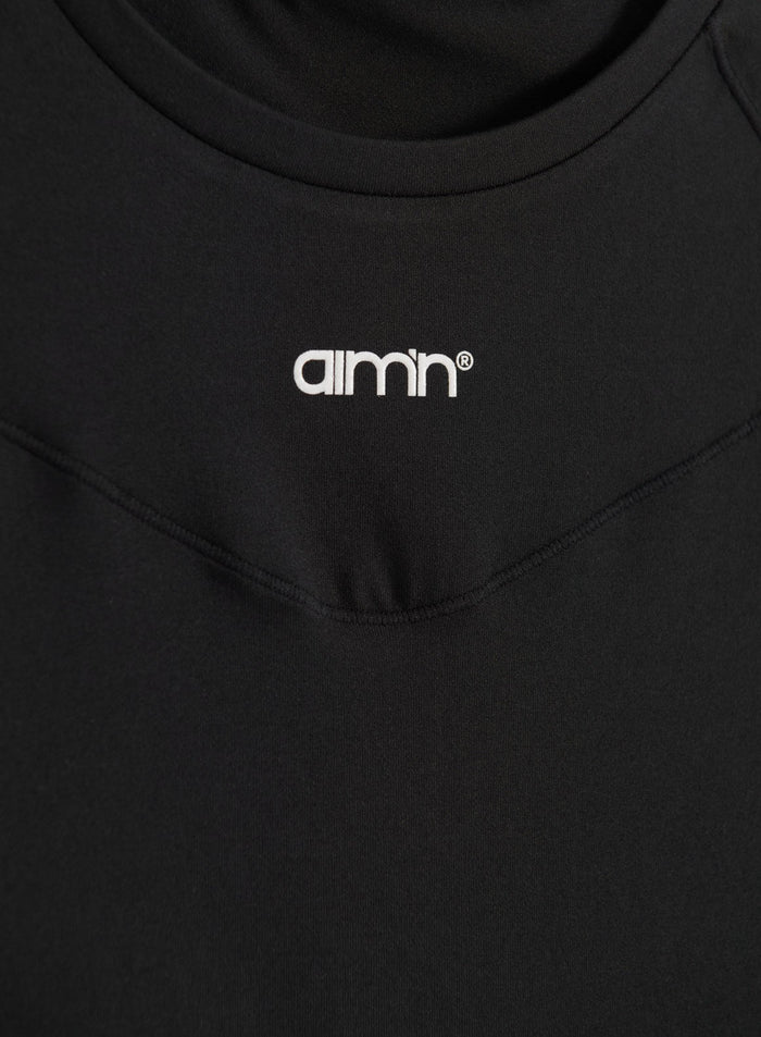 Black Soft Basic Short Sleeve top featuring a white printed aim'n logo and classic round neck.