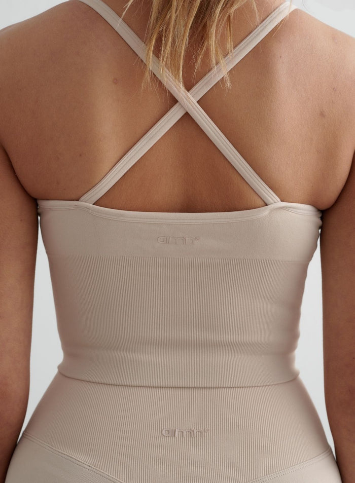 Clay-coloured Shape Seamless Cross Back Bralette by aim'n featuring a ribbed texture and thin cross-back straps.
