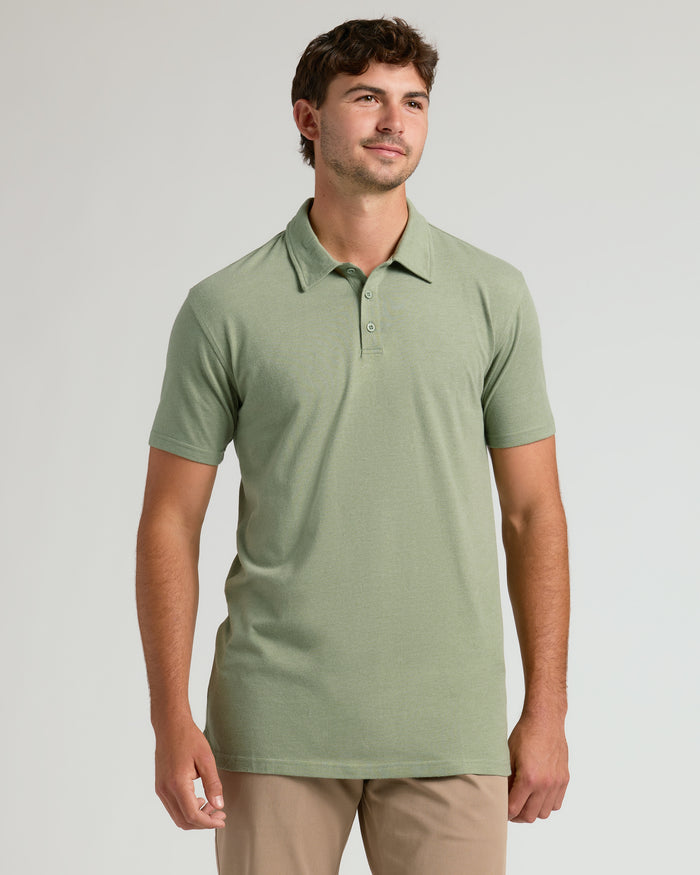 Man modeling Dark Heather Bay Green Short Sleeve Tall Polo.