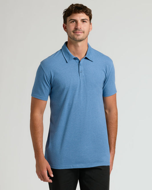 Young man in Dark Heather Blue Lake Short Sleeve Tall Polo.