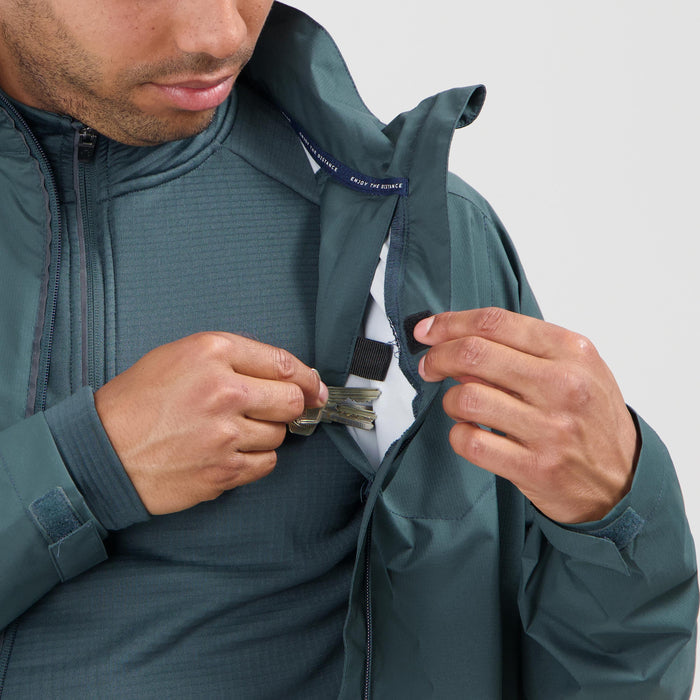 Detail van Rogelli Essential hardloopjack heren blauw opbergzak binnenkant.
