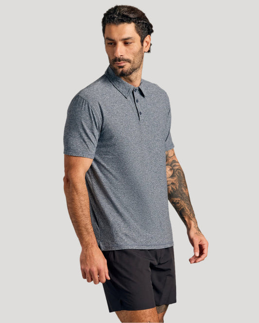 Heather Navy Short Sleeve Active Polo worn by man with nature-themed tattoo.