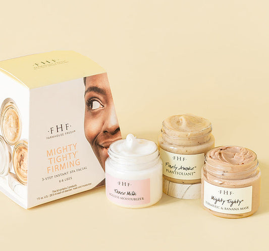 Mighty Tighty® Firming 3-step Instant Spa Facial | Farmhouse Fresh skincare set with Three Milk Moisturizer, Finely Awaken Plant Exfoliant, and Mighty Tighty Turmeric & Banana Mask in jars and packaging.