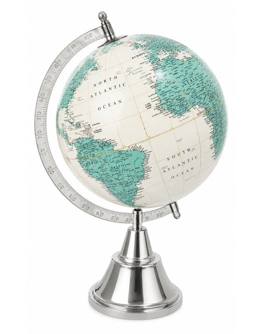 Studio view of desktop world globe with teal continents and chrome base