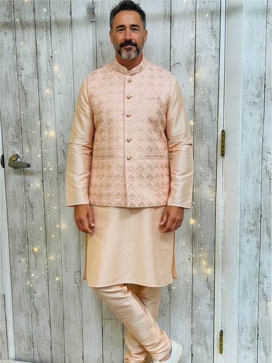 Man wearing a Kurti Connection USA silk kurta pajama set with a patterned light pink Nehru jacket