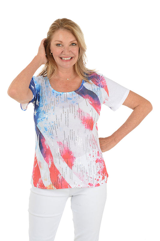 Woman wearing a colorful abstract patterned top on a white background