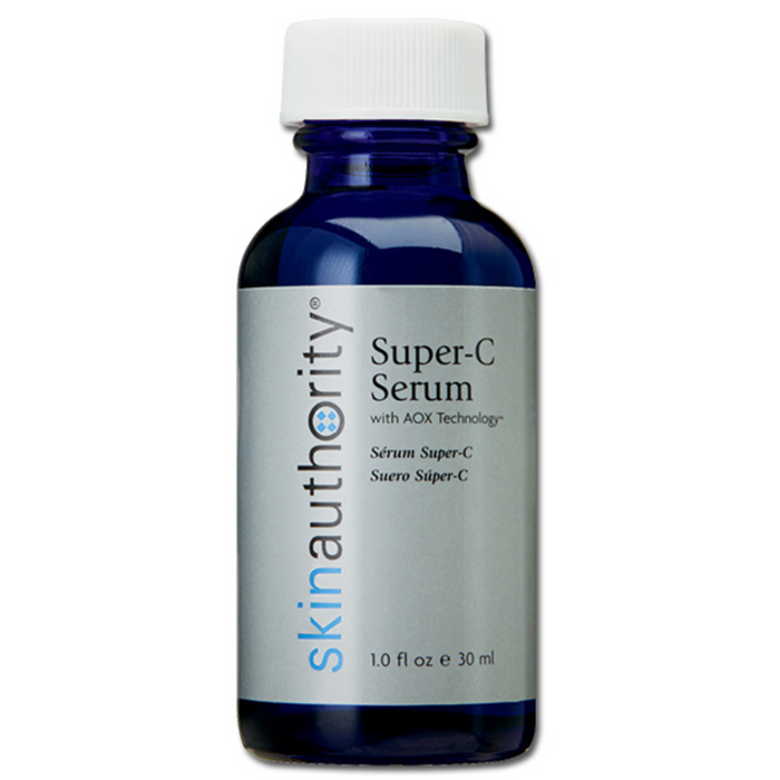 Blue glass bottle of Super-C Serum | Skin Authority with white cap and silver label featuring the product name and skincare branding.