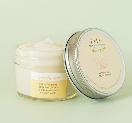 Open jar of Will Dew® Organic Probiotic Milk Balancing Mask | Farmhouse Fresh showing creamy texture and label detailing skin benefits like calming irritations and balancing bacteria.