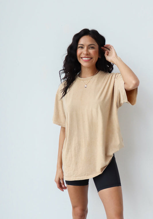 "Feel like a rockstar in our comfortable and on-trend band tee in latte brown. Our super soft oversized t-shirt is perfect for that elevated, lived-in feel. Made with 100% cotton and a vintage inspired mineral wash, you will never want to take it off!

Fabric: 100% cotton
Care: Machine wash
Fit: Oversized"